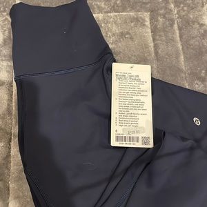 LULULEMON WUNDER TRAIN HR TIGHT 25” PKTS TRNV